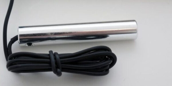 A close up of the side of a pen and cord